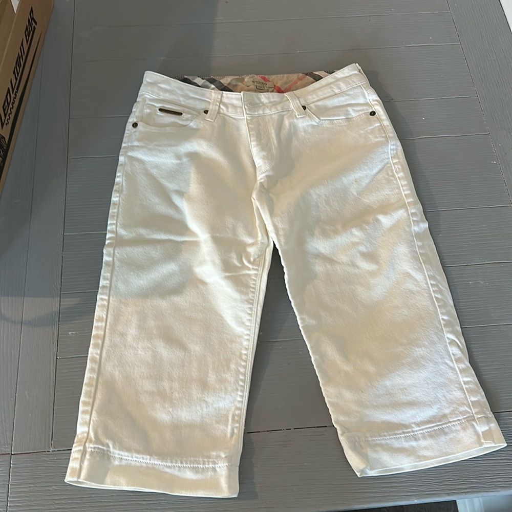 Woman’s white Burberry capri jeans